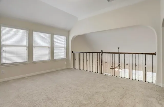 a view of a livingroom with entryway and a window