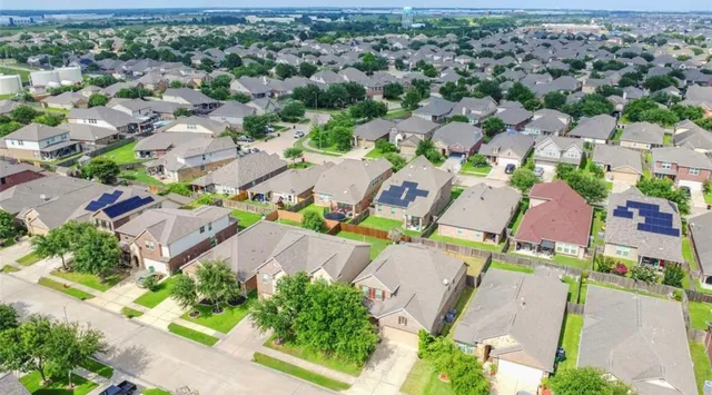 an aerial view of a city with lots of residential buildings