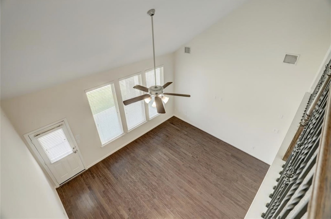 9972 Spring Rock Lane Brookshire, TX 77423 - Photo 4 of 16 a view of a room with wooden floor and white walls