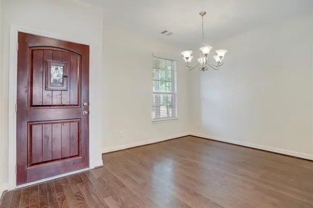 a view of a livingroom with wooden floor