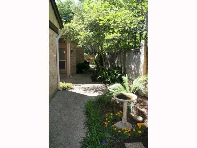 7922 Ridgeline North Austin, TX 78759 - Photo 26 of 31 Courtyard extends the side length of the property and overlooks the HOA greenbelt(to the right).