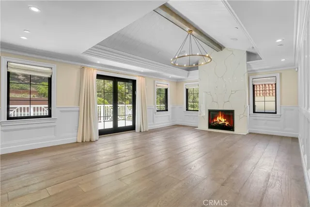 a large bathroom with a large tub shower and sink