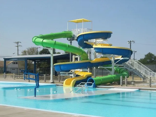 a view of a swimming pool with a chair and tables