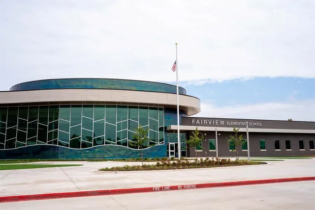 a view of a house with a iron gate