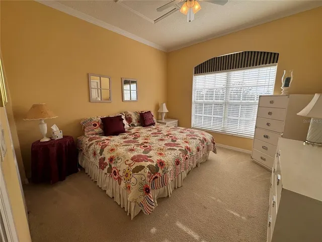 a living room with furniture and a lamp