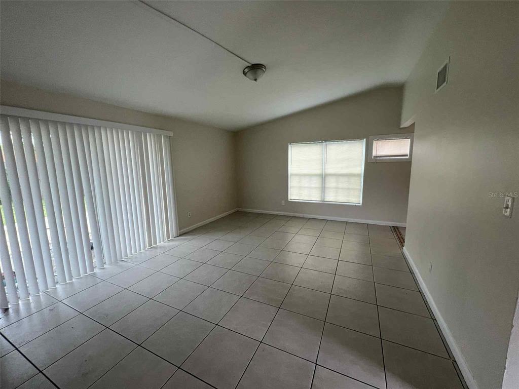 5825 Forest Grove Boulevard Orlando, FL 32808 - Photo 12 of 19 a view of an empty room with a window