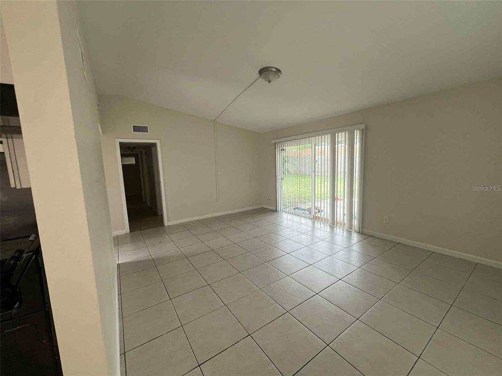 5825 Forest Grove Boulevard Orlando, FL 32808 - Photo 9 of 19 a view of an empty room and window