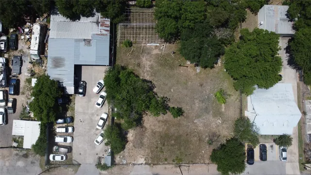 an aerial view of a house with outdoor space