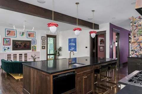 a view of hallway with furniture and a window