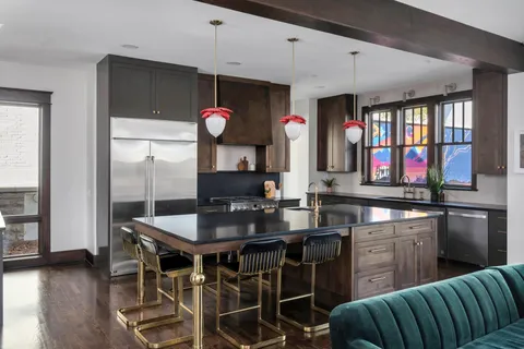 a view of an entryway with wooden floor