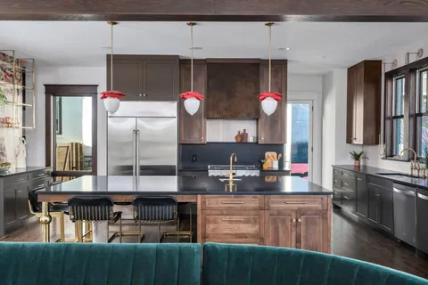 a living room with furniture a fireplace and a window
