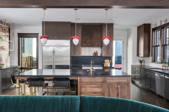 a living room with furniture a fireplace and a window