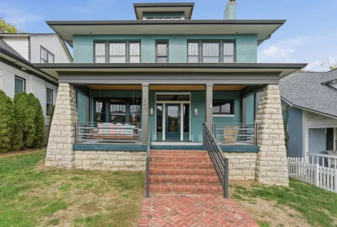 a view of a livingroom with furniture and chandelier fan
