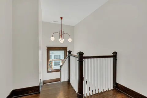 a bathroom with a sink mirror and window