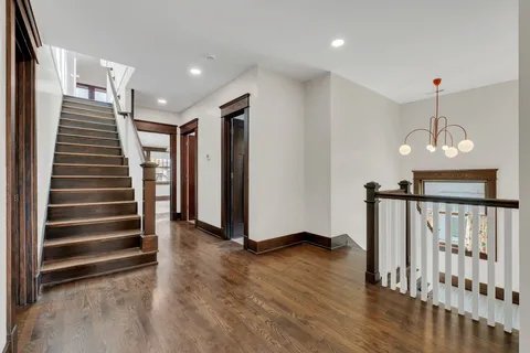 a bed room with a bed and a chair