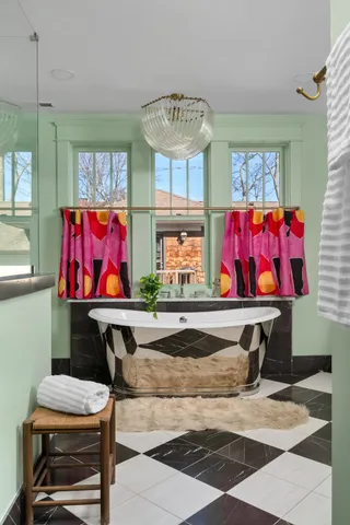 a bathroom with a toilet a sink and a window