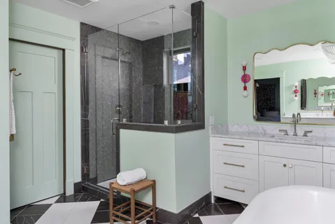 a bedroom with furniture and a chandelier