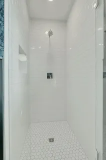 a view of balcony with two chairs and a barbeque