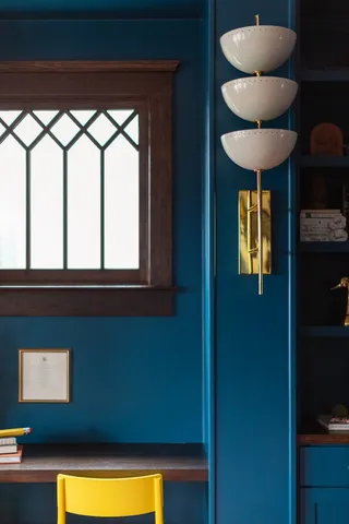 a kitchen with stainless steel appliances granite countertop a sink dishwasher a microwave oven and a dining table with wooden floor