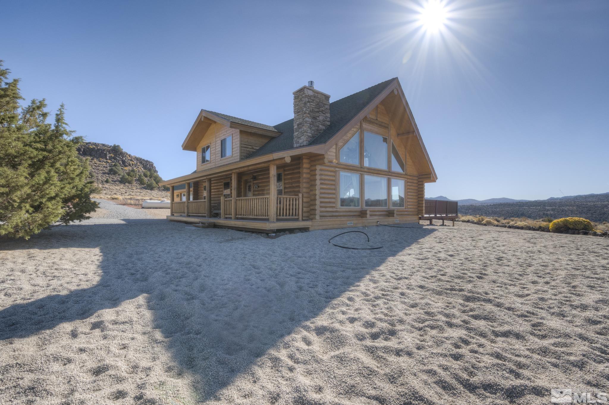 2740 Goldfield Road Reno, NV 89521 - Photo 1 of 39 a view of a house with a yard and wooden fence