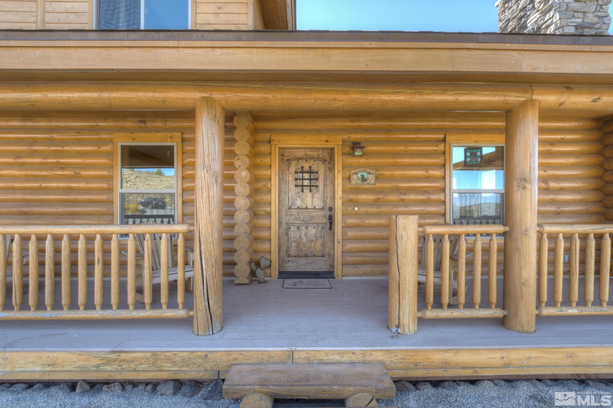 2740 Goldfield Road Reno, NV 89521 - Photo 6 of 39 a view of a porch with a table and chair