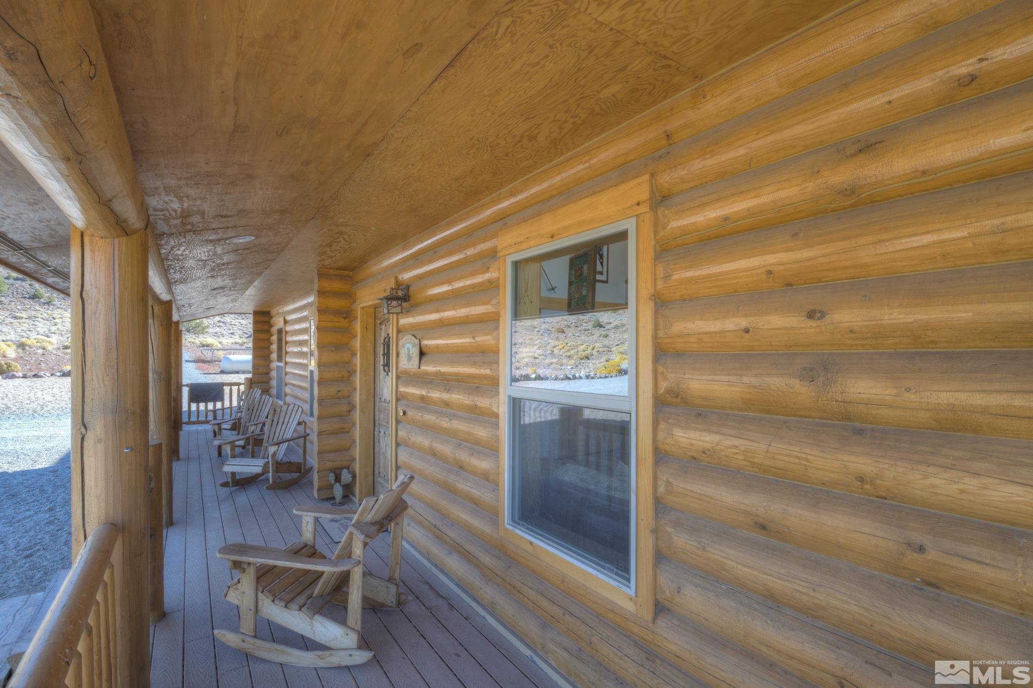 2740 Goldfield Road Reno, NV 89521 - Photo 7 of 39 a view of a hallway with wooden floor and furniture