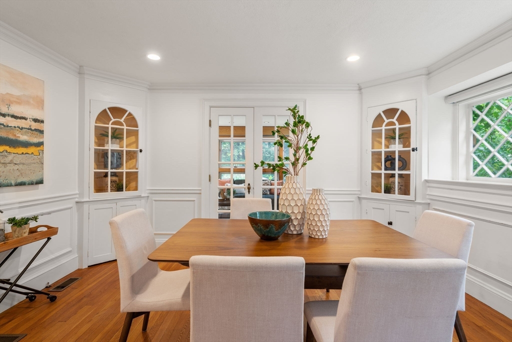 151 Woodcliff Road Newton, MA 02461 - Photo 13 of 33 a dining room with furniture a window and wooden floor