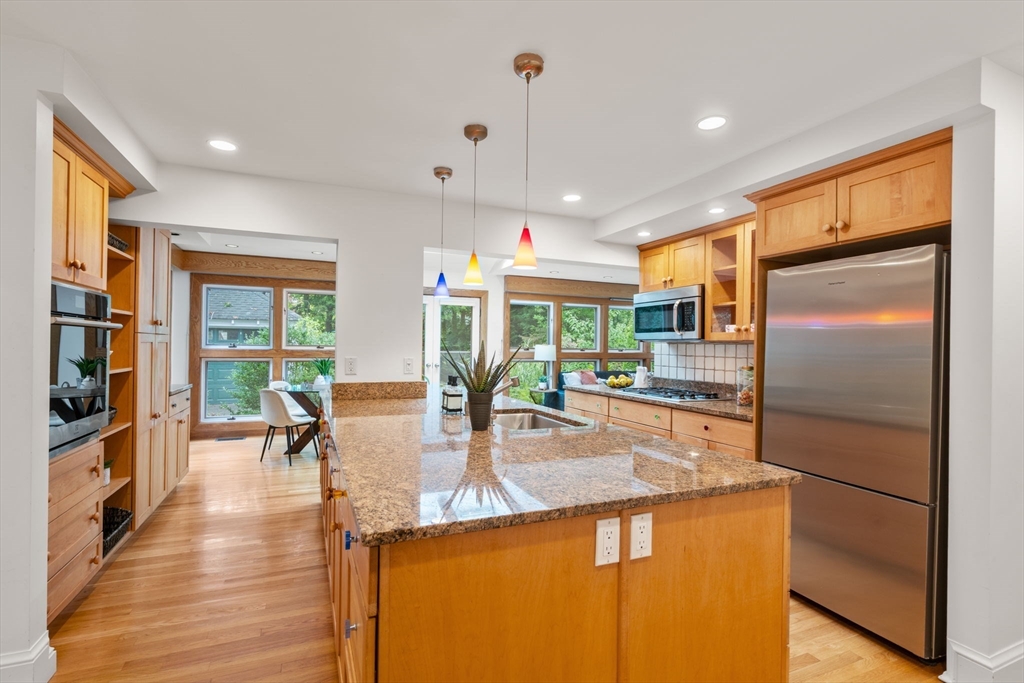 151 Woodcliff Road Newton, MA 02461 - Photo 2 of 33 a kitchen with stainless steel appliances granite countertop a refrigerator a stove and a wooden floors