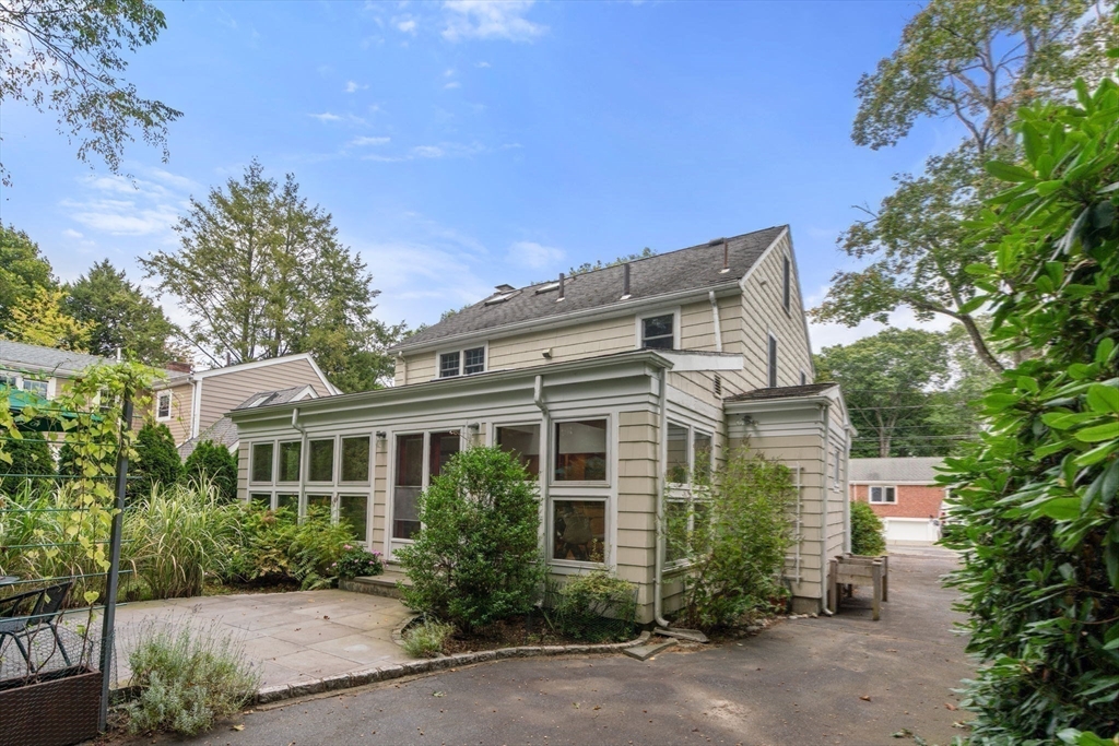 151 Woodcliff Road Newton, MA 02461 - Photo 27 of 33 a front view of a house with a garden