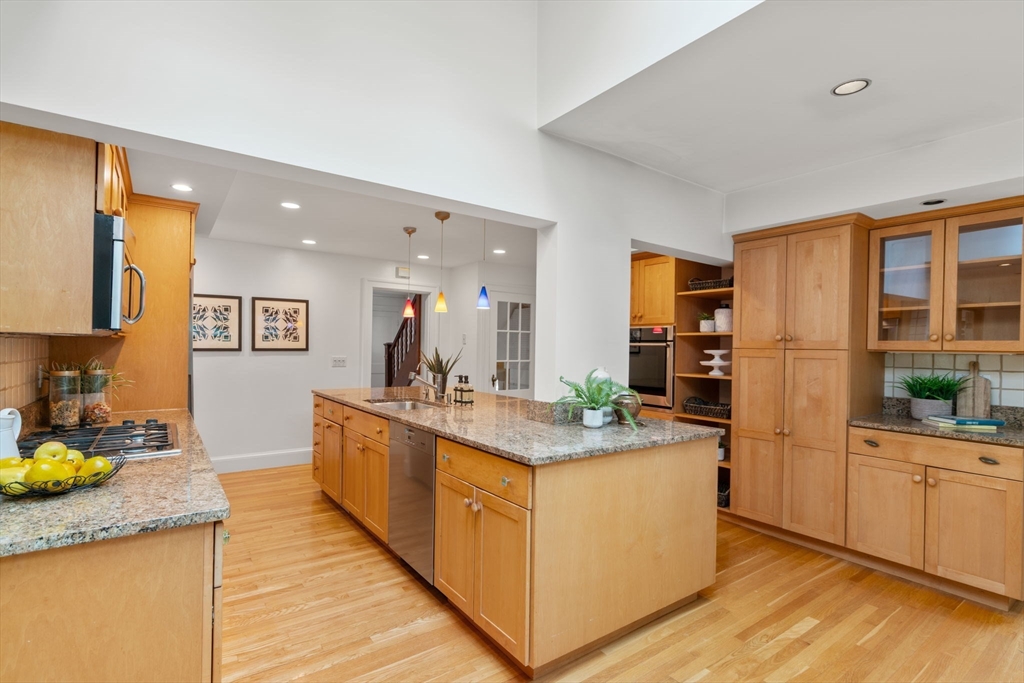 151 Woodcliff Road Newton, MA 02461 - Photo 3 of 33 a large kitchen with stainless steel appliances lots of counter space and wooden floor