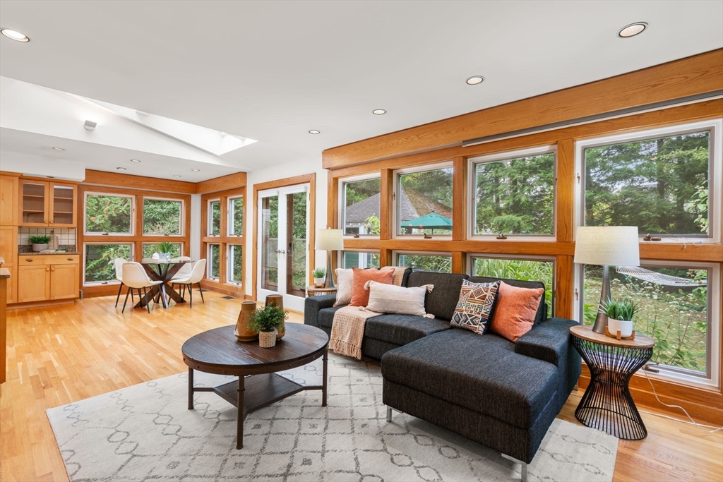 151 Woodcliff Road Newton, MA 02461 - Photo 7 of 33 a living room with furniture and floor to ceiling windows