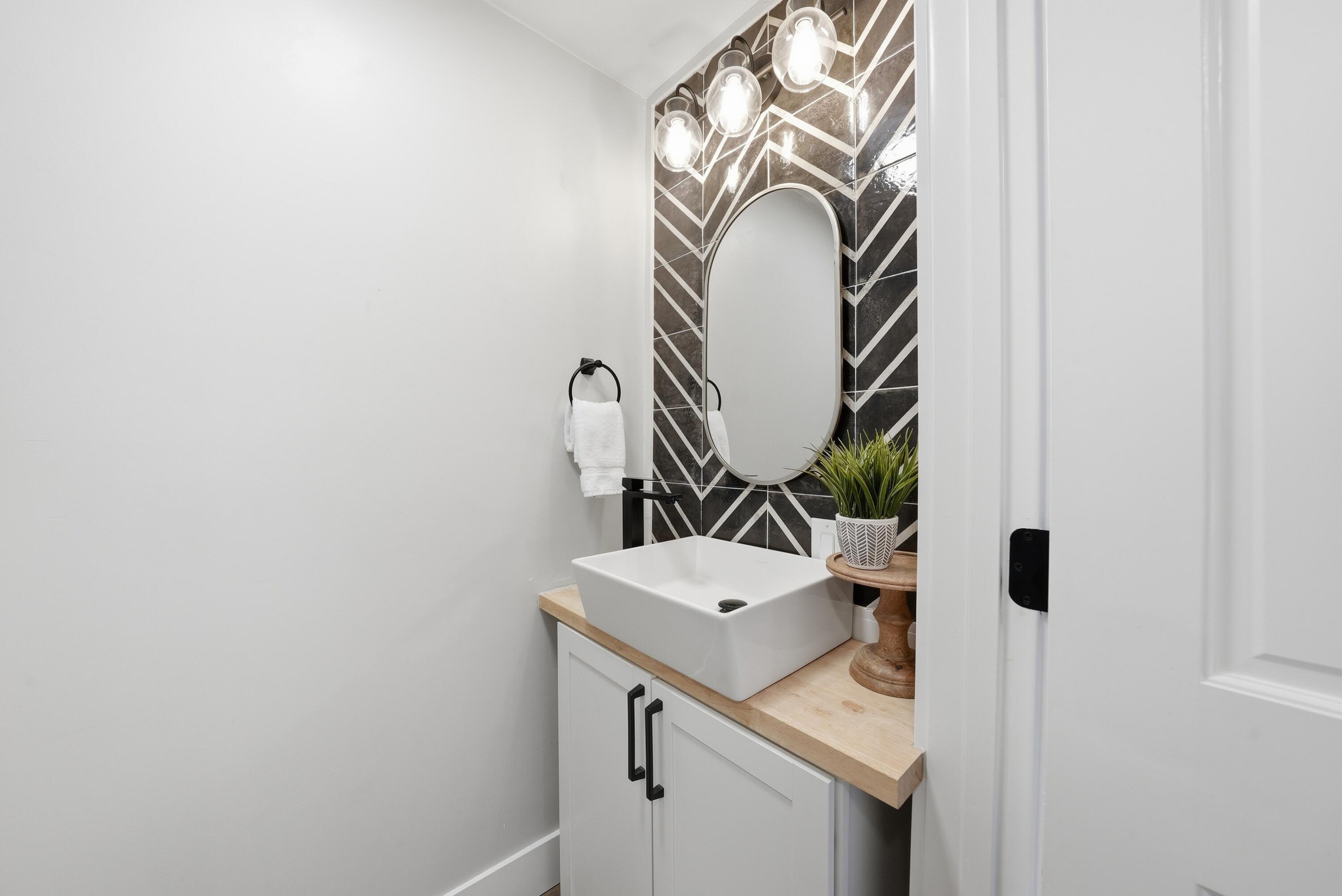 1961 Southwest Knoll Avenue Bend, OR 97702 - Photo 27 of 53 a bathroom with a sink and a mirror