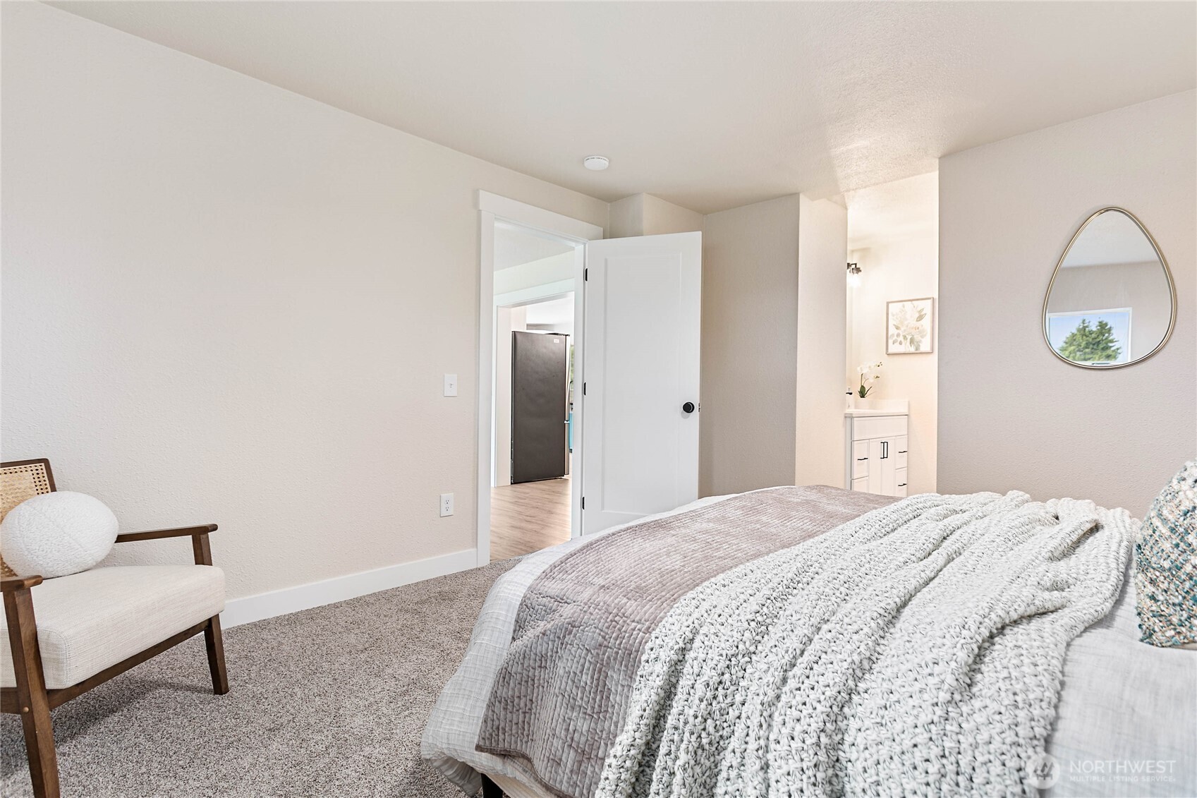 306 West Pole Road Lynden, WA 98264 - Photo 11 of 25 a bedroom with a bed and a chair