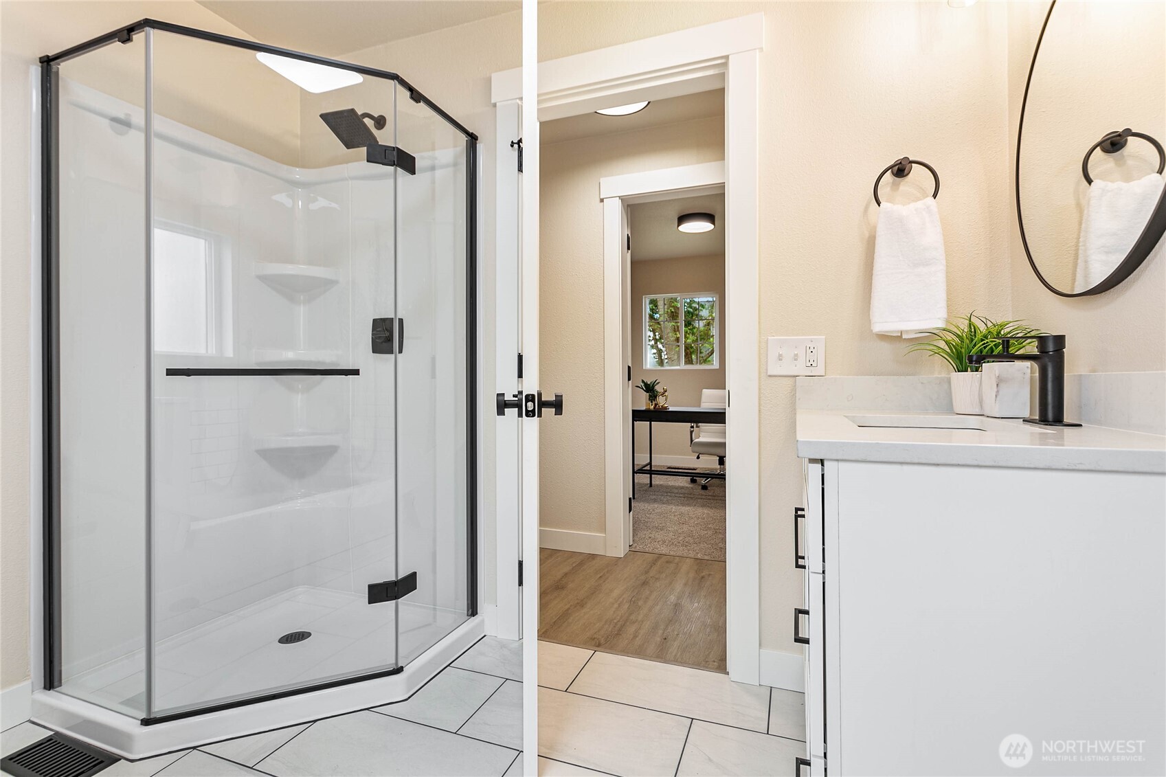 306 West Pole Road Lynden, WA 98264 - Photo 16 of 25 a bathroom with a shower sink and mirror