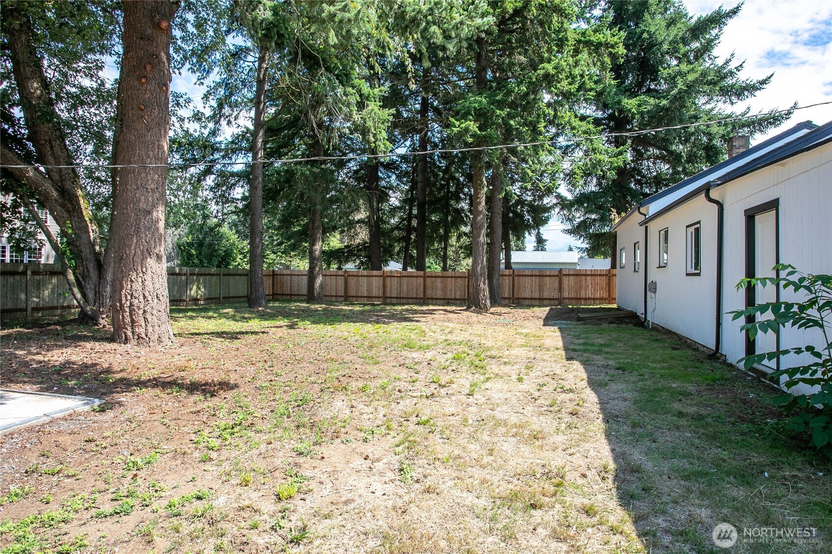 306 West Pole Road Lynden, WA 98264 - Photo 21 of 25 a house with trees in front of it