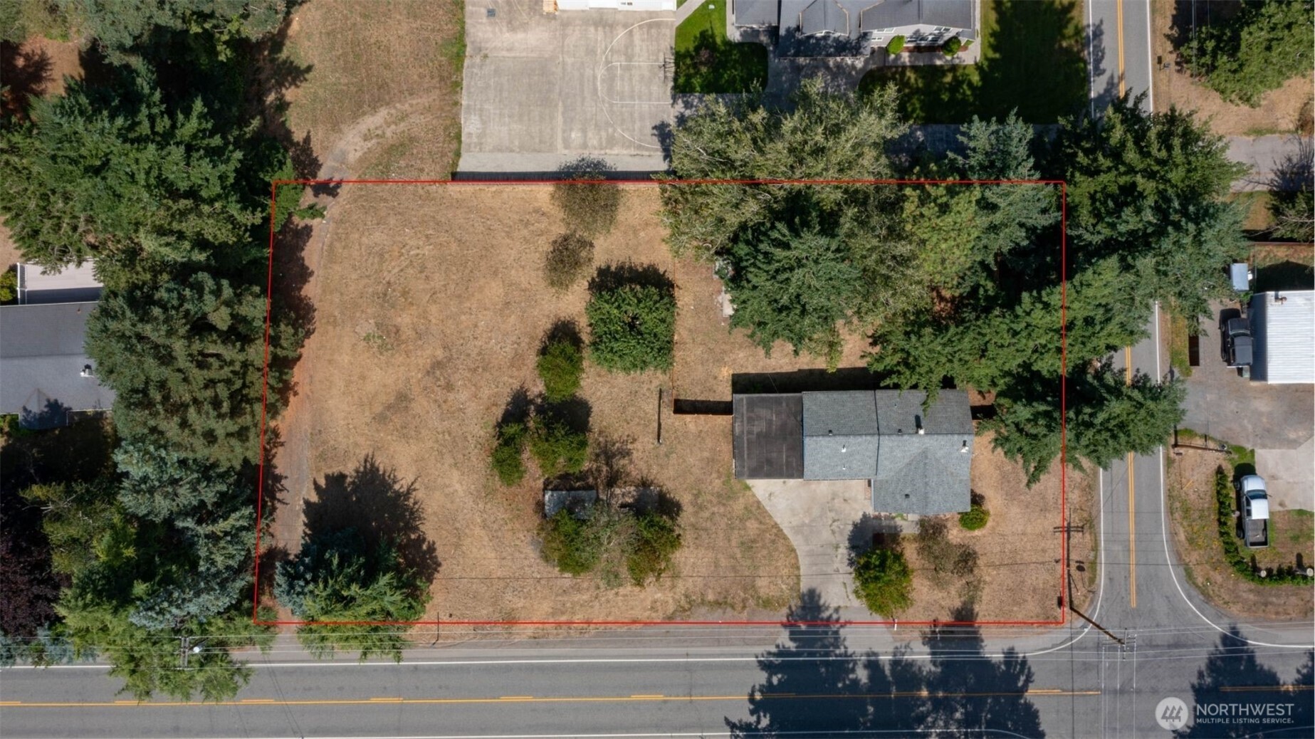 306 West Pole Road Lynden, WA 98264 - Photo 25 of 25 an aerial view of a house with swimming pool and large trees