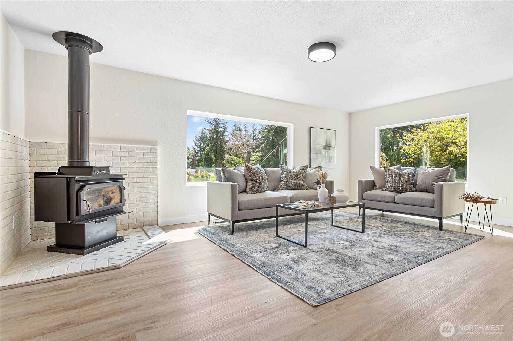306 West Pole Road Lynden, WA 98264 - Photo 5 of 25 a living room with furniture and a fireplace