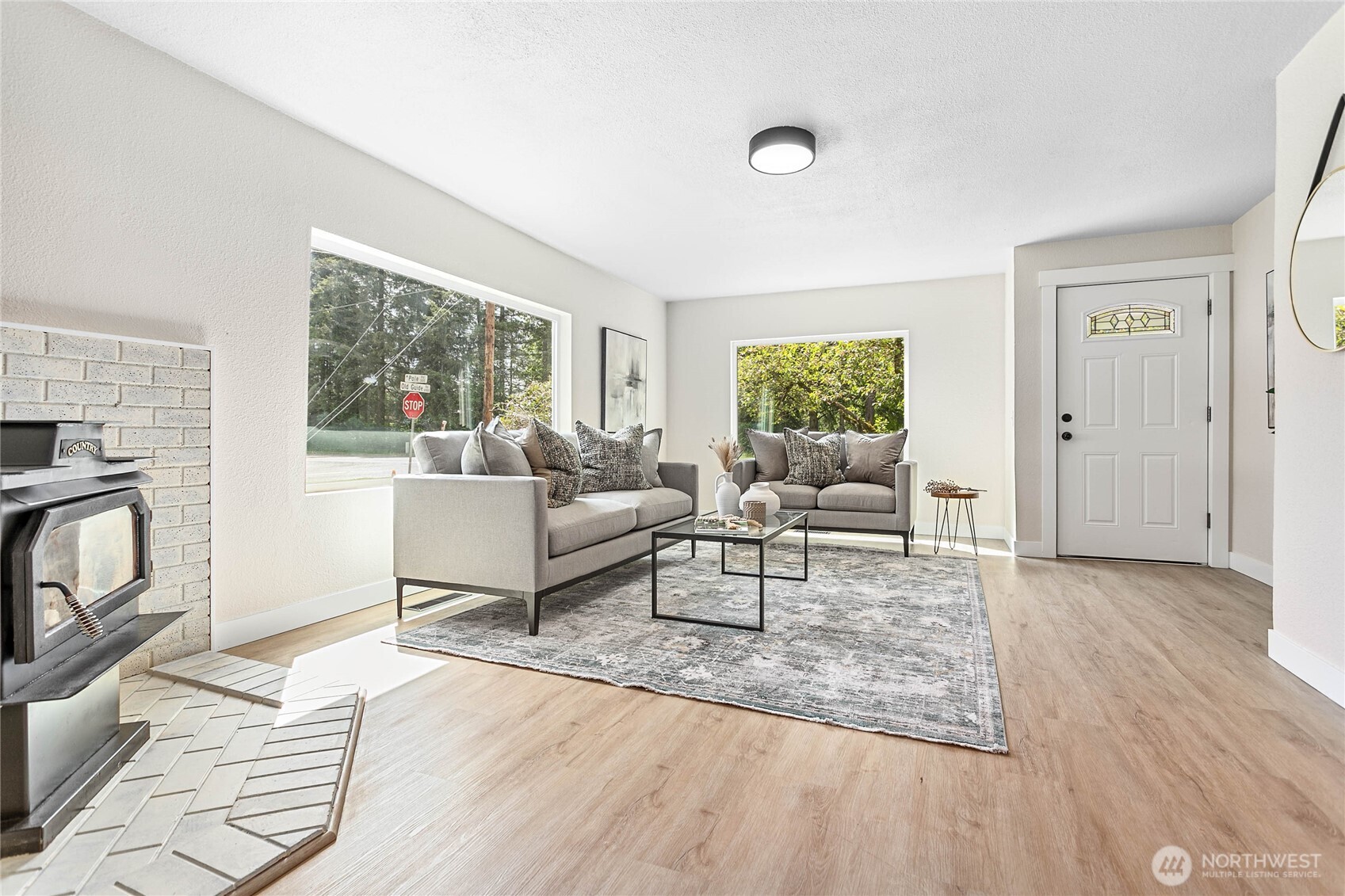 306 West Pole Road Lynden, WA 98264 - Photo 6 of 25 a living room with furniture and a fireplace