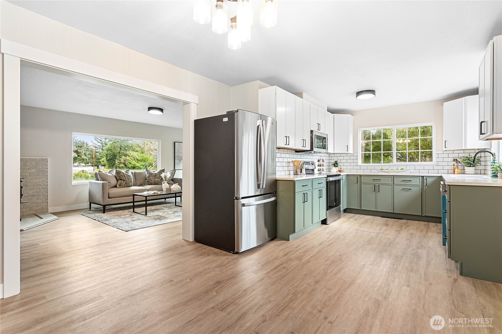 306 West Pole Road Lynden, WA 98264 - Photo 7 of 25 a kitchen with a refrigerator and a sink