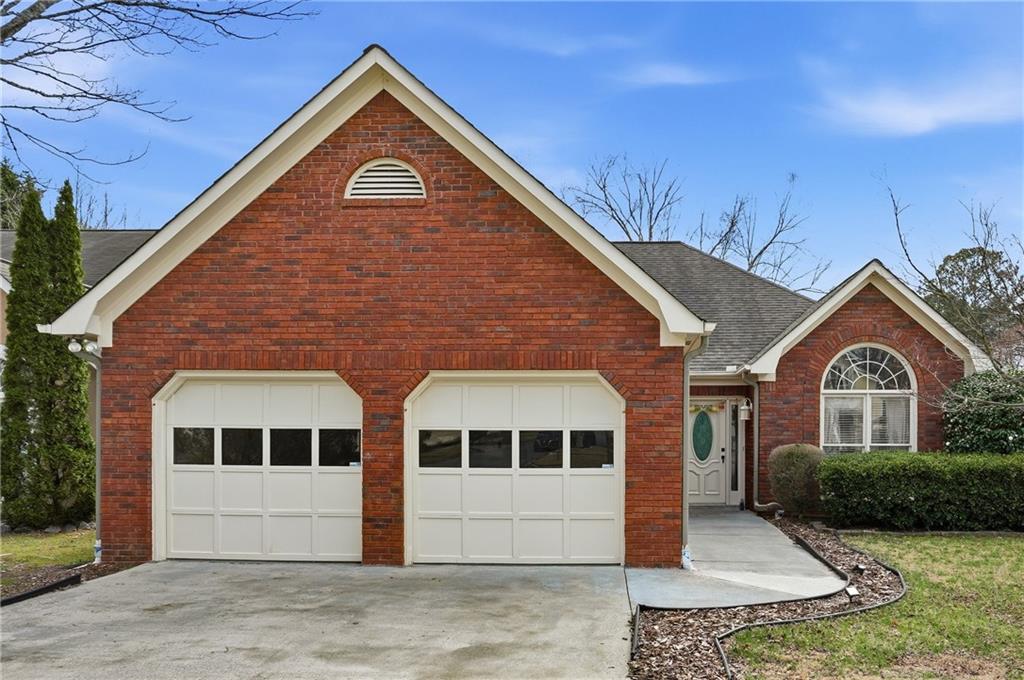 4821 Devon Lane Alpharetta, GA 30004 - Photo 1 of 1 a front view of a house with a yard