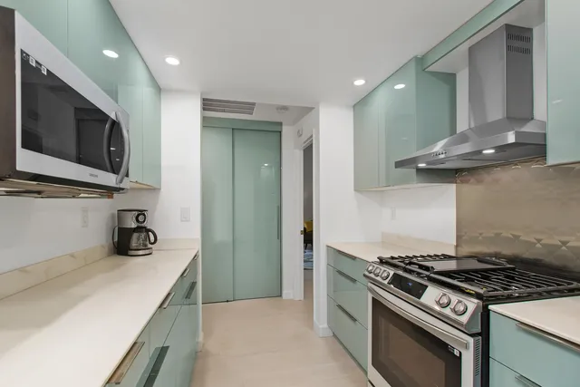 a kitchen with a stove and a microwave