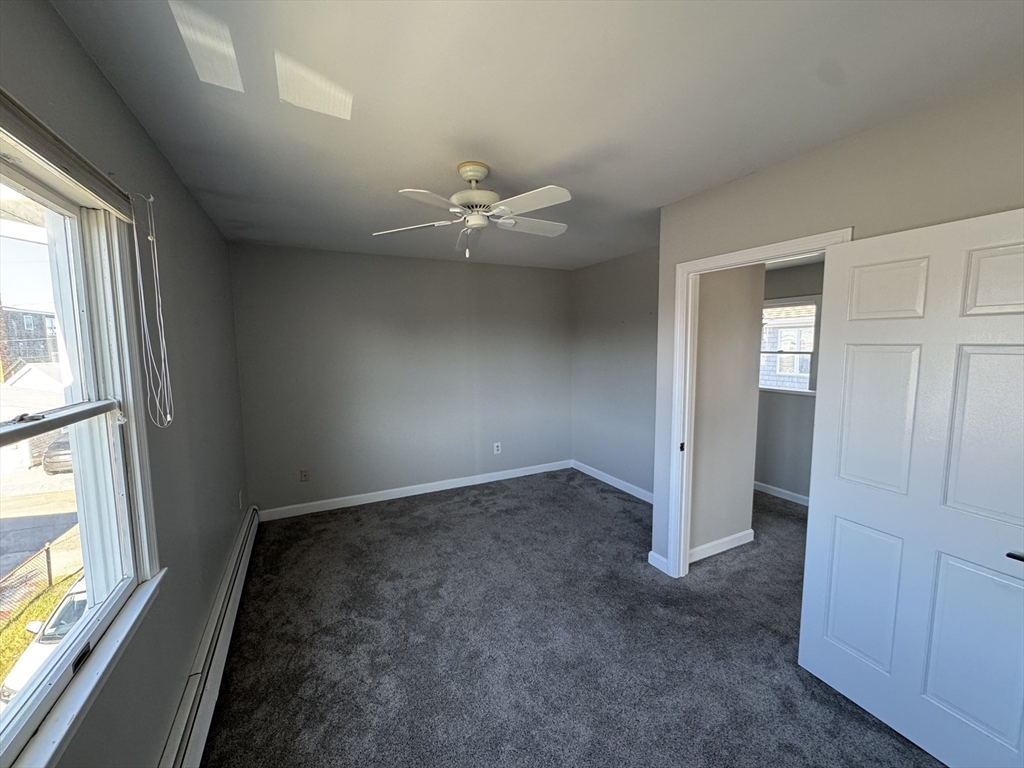 23 Gunrock Avenue Hull, MA 02045 - Photo 25 of 30 wooden floor in an empty room with a window