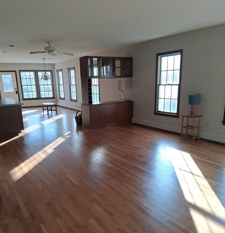23 Gunrock Avenue Hull, MA 02045 - Photo 5 of 30 wooden floor in an empty room with a window