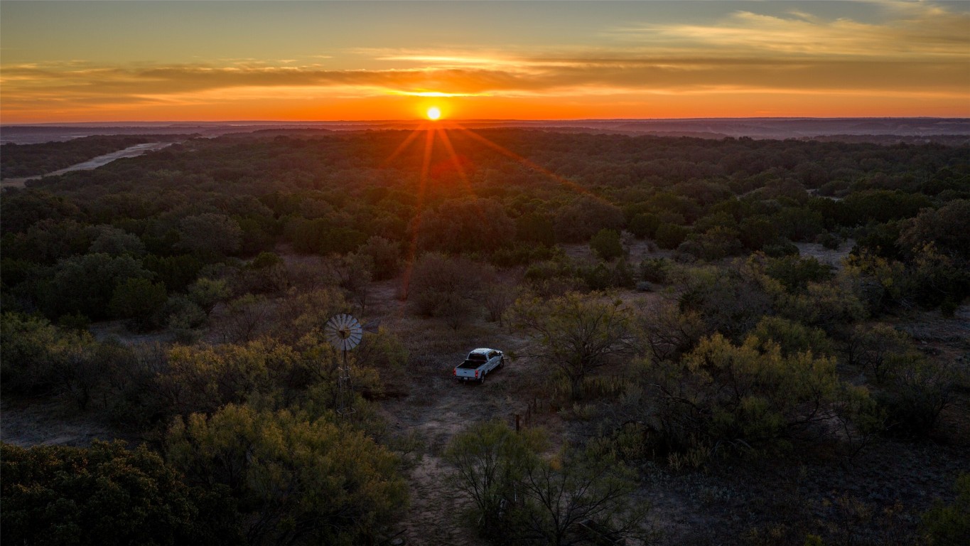 532 County Road 468 Rochelle, TX 76872 - Photo 20 of 39 Aerial view at dusk of a wooded view