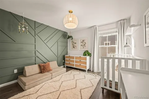 a spacious bathroom with a double vanity sink a toilet and a shower