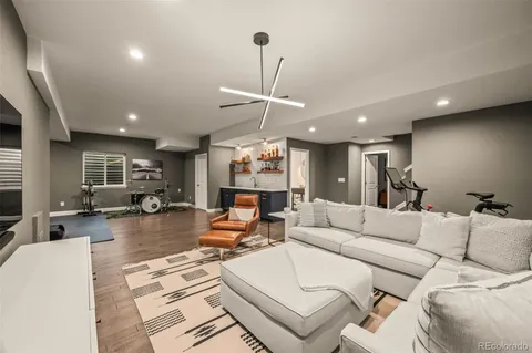 a room with wooden floors and stairs