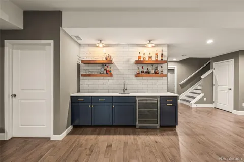 a bathroom with a toilet a sink and a mirror