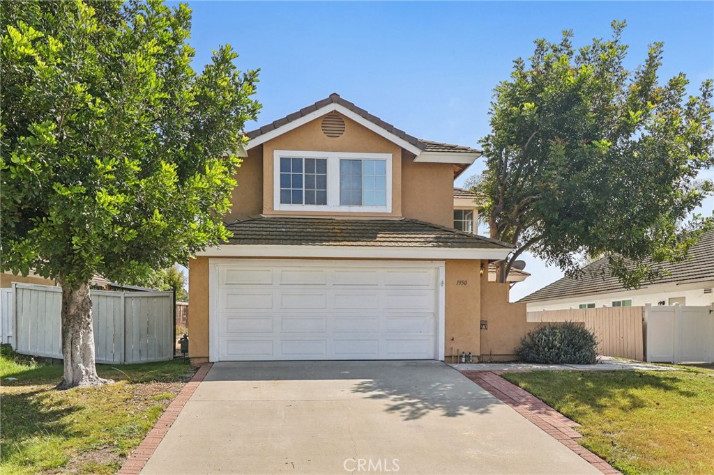 1950 Rue Michelle Chula Vista, CA 91913 - Photo 1 of 1 a front view of a house with a yard and garage