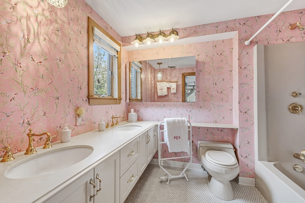 94 Howland Road Westport, MA 02790 - Photo 24 of 33 a bathroom with a granite countertop toilet sink and mirror