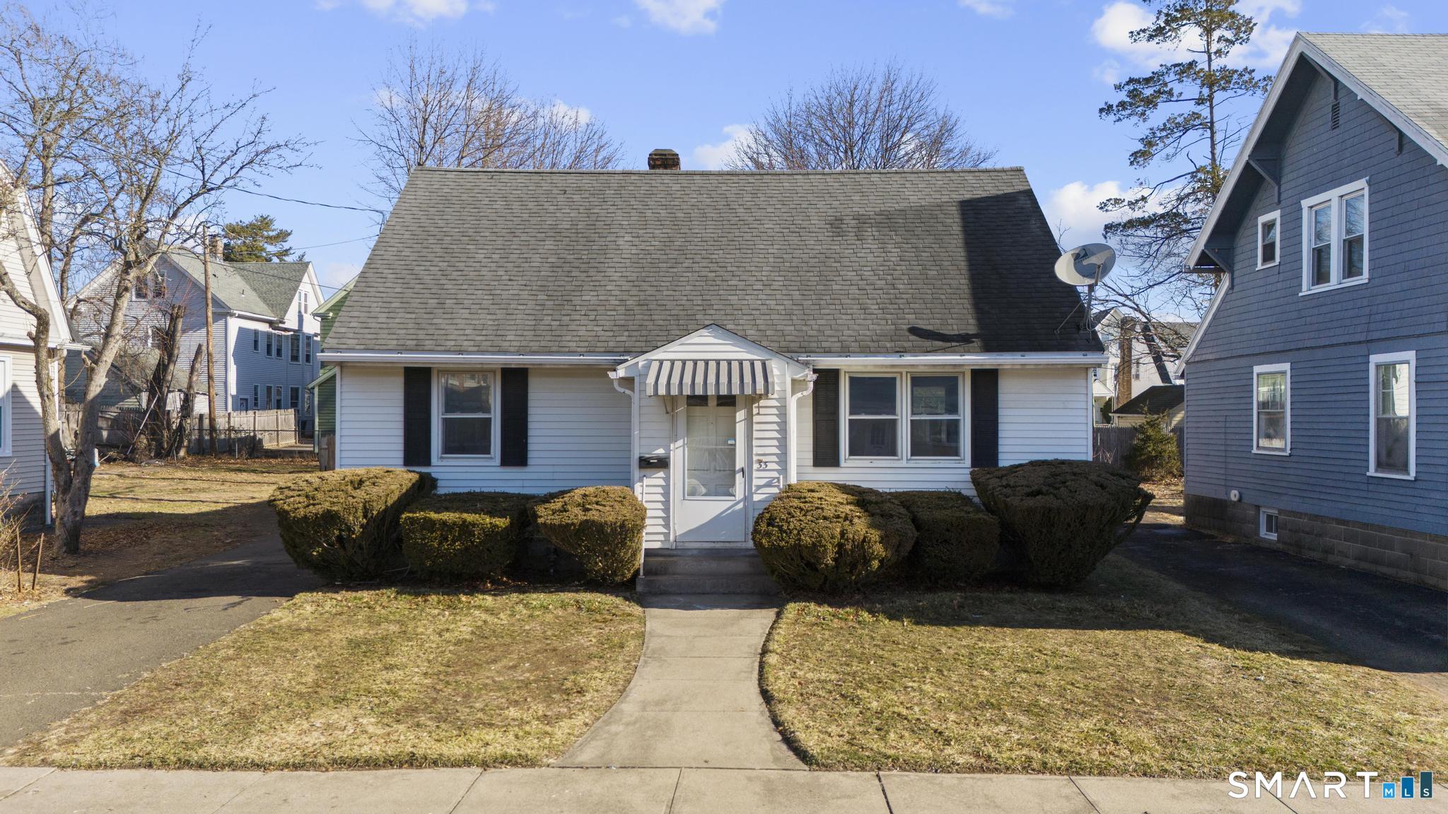 33 Newton Street Hamden, CT 06514 - Photo 1 of 1 a view of a house with a bed and a fireplace